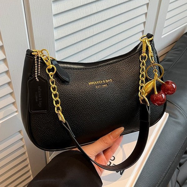 Black PU dumpling bag with pendant, gold chain, one-shoulder strap, zipper closure, small size.